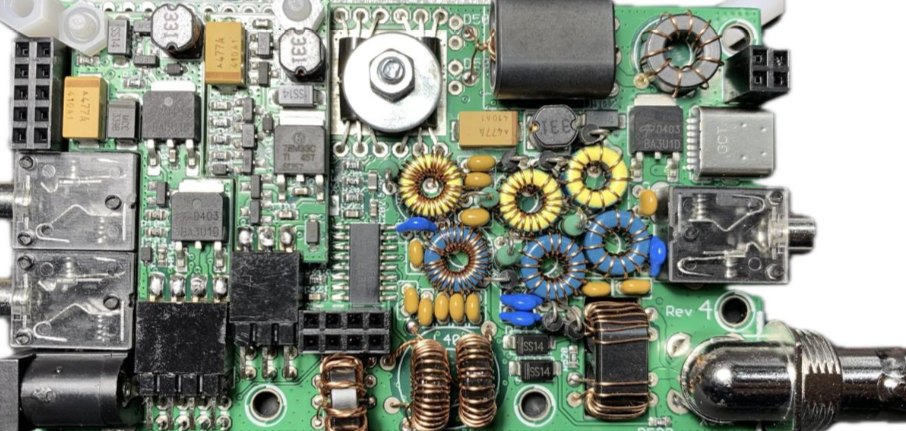 Assembled QRP Labs QMX circuit board with hand-wound toroids